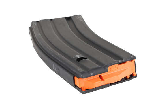 The Ammunition Storage Components 5.56 AR-15 magazine with orange follower uses heat treated stainless steel follower springs